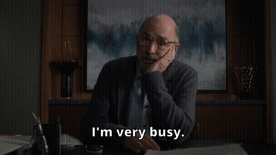 Man In White Coat Looking At Woman In Plaid Shirt GIF