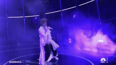 Man In White Dress Singing Stage Purple Smoke GIF