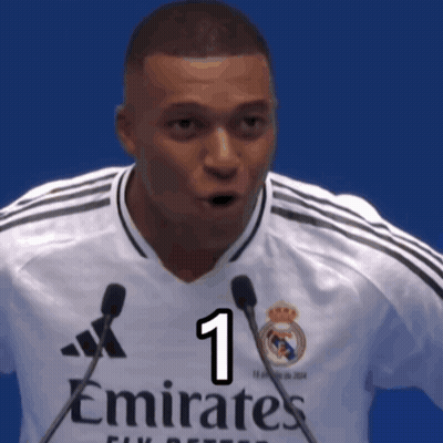 Man In White Emirates Jersey Holding Two Microphones GIF