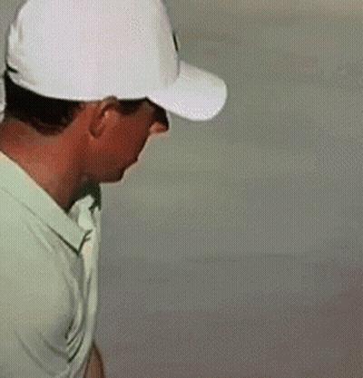 Man In White Hat And Green Shirt Looking Down GIF