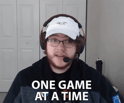 Man In White Hat And Headphones Says One Game At A Time GIF