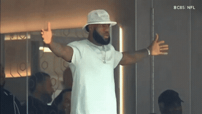Man In White Hat And White Shirt CBS NFL Logo GIF