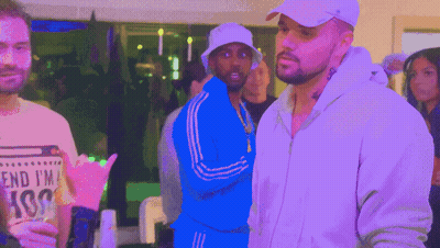 Man in White Hat Next to Man in Blue Jacket Saying End I'm Ass