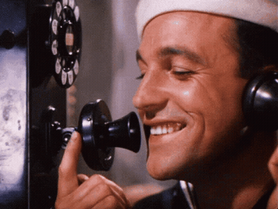 Man In White Hat Smiling On Phone GIF