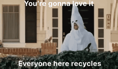 Man In White Hooded Costume In Front Of House GIF
