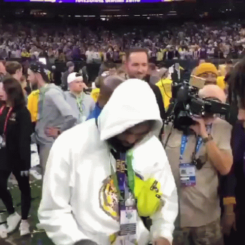 Man In White Hoodie Before Crowd GIF