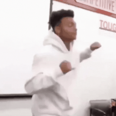 Man In White Hoodie Dancing In Classroom GIF
