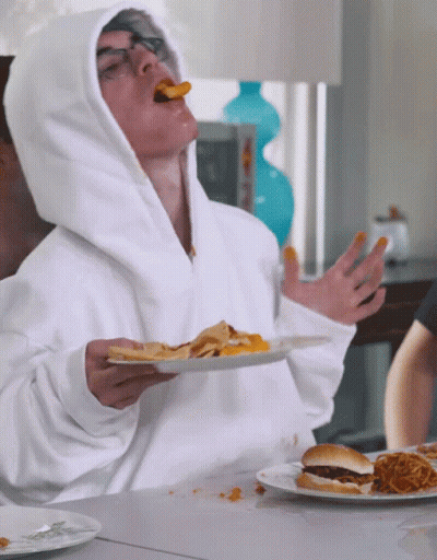 Man In White Hoodie Eating French Fries GIF