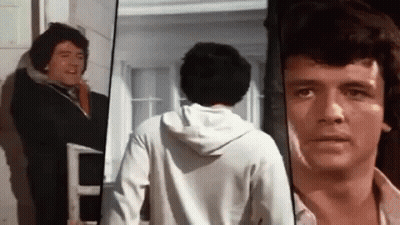 Man In White Hoodie Looking At Camera GIF