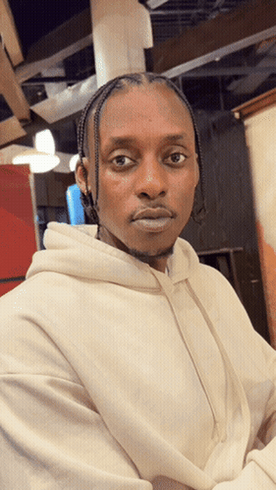 Man In White Hoodie Looks Serious GIF