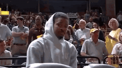 Man In White Hoodie Watching Basketball Game In Crowd GIF