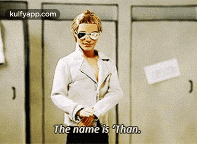 Man In White Jacket And Sunglasses Saying The Name Is Than GIF