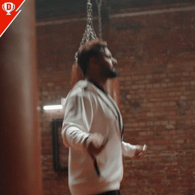 Man In White Jacket By Brick Wall Match Ke Liye Taiyaar GIF