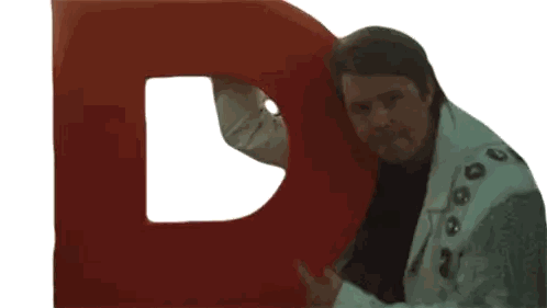 Man In White Jacket Holding Red D Sticker