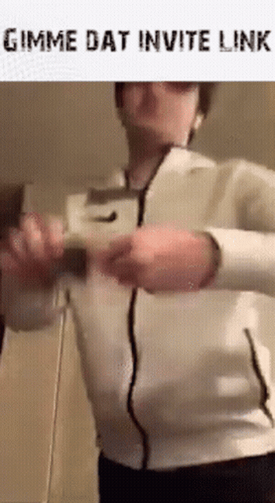Man In White Jacket Holding Remote Control GIF