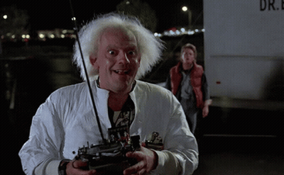 Man In White Jacket Holding Remote In Front Of Truck Saying Dr GIF