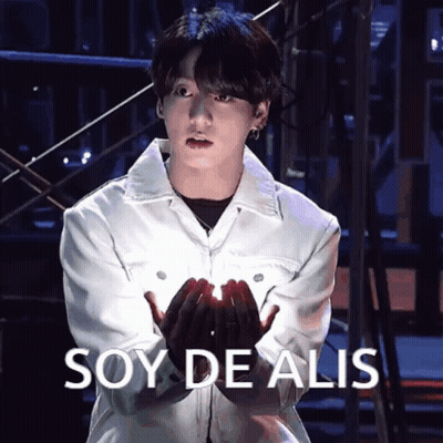 Man In White Jacket Holding Something Soy De Alis GIF