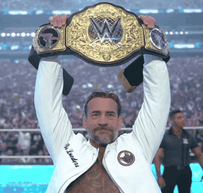 Man In White Jacket Holding Wrestling Championship Belt GIF