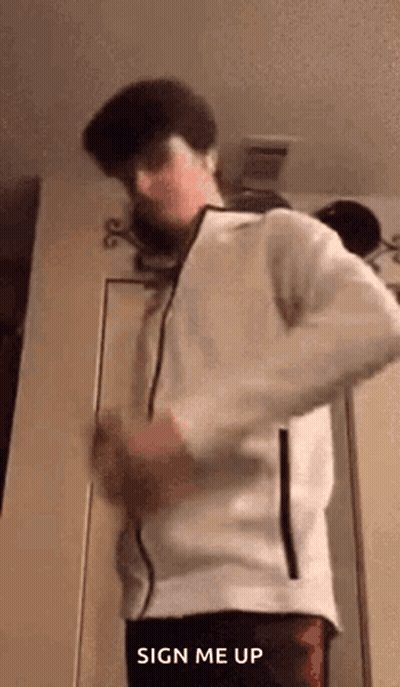 Man In White Jacket Making Funny Face At Door GIF