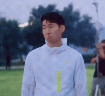 Man In White Jacket On Soccer Field GIF