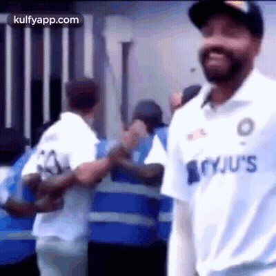 Man In White Jersey Standing Before Crowd GIF