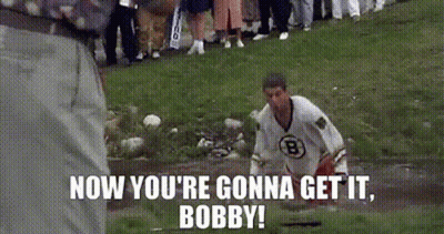 Man In White Jersey Standing In Muddy Field GIF
