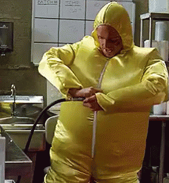 Man In White Jumpsuit In Hallway GIF