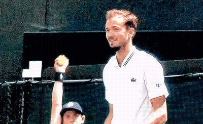 Man In White Lacoste Shirt Holding Tennis Ball GIF