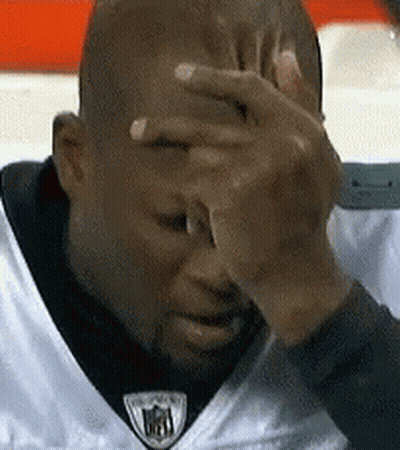 Man In White NFL Jersey Covering Face GIF