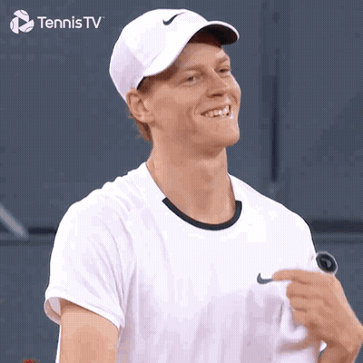 Man In White Nike Hat Smiling Holding Tennis Racquet GIF