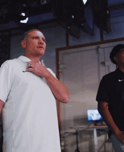Man In White Nike Shirt Adjusting Tie GIF