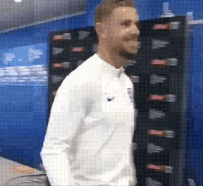 Man In White Nike Shirt In Blue Room GIF