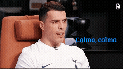 Man In White Nike Shirt Sitting In Orange Chair GIF