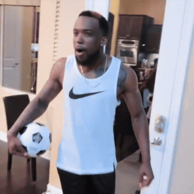 Man In White Nike Tank Top Holding Soccer Ball GIF