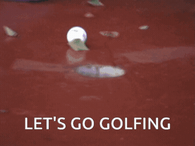 Man In White Polo And Blue Pants Standing In Front Of Building GIF