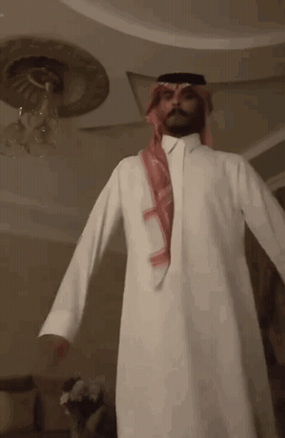 Man In White Robe And Red Scarf GIF