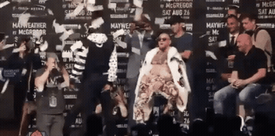 Man In White Robe At Mayweather Wall GIF
