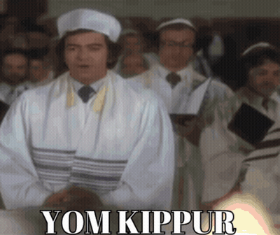 Man In White Robe Before Crowd Saying Yom Kippur GIF
