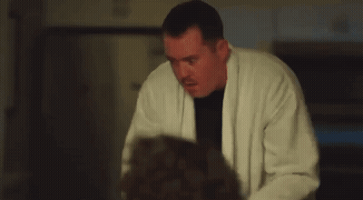 Man In White Robe Holding Gun GIF