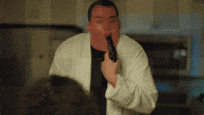 Man In White Robe Holding Gun In Mouth GIF