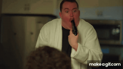 Man In White Robe Holding Gun GIF