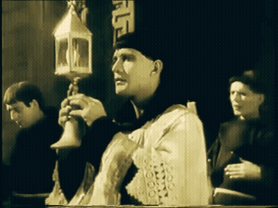 Man In White Robe Holding Lantern GIF