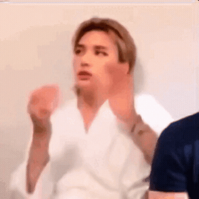 Man In White Robe Making A Face GIF