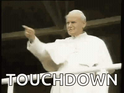 Man In White Robe Pointing GIF