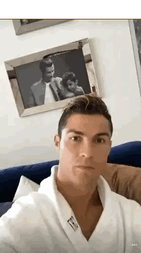 Man In White Robe Taking Selfie Sticker