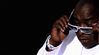 Man In White Shirt Adjusting Sunglasses GIF
