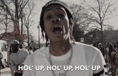 Man In White Shirt And Black Hat Says Hol Up GIF