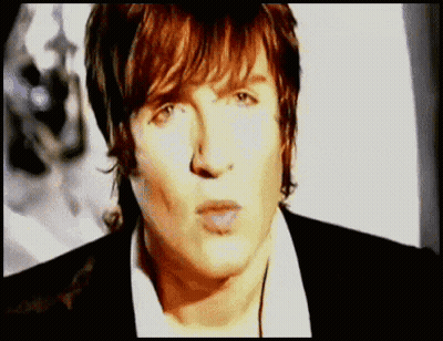 Man In White Shirt And Black Jacket Close Up GIF