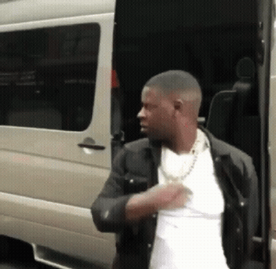 Man In White Shirt And Black Jacket Next To Van GIF