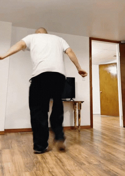 Man In White Shirt And Black Pants Dancing GIF